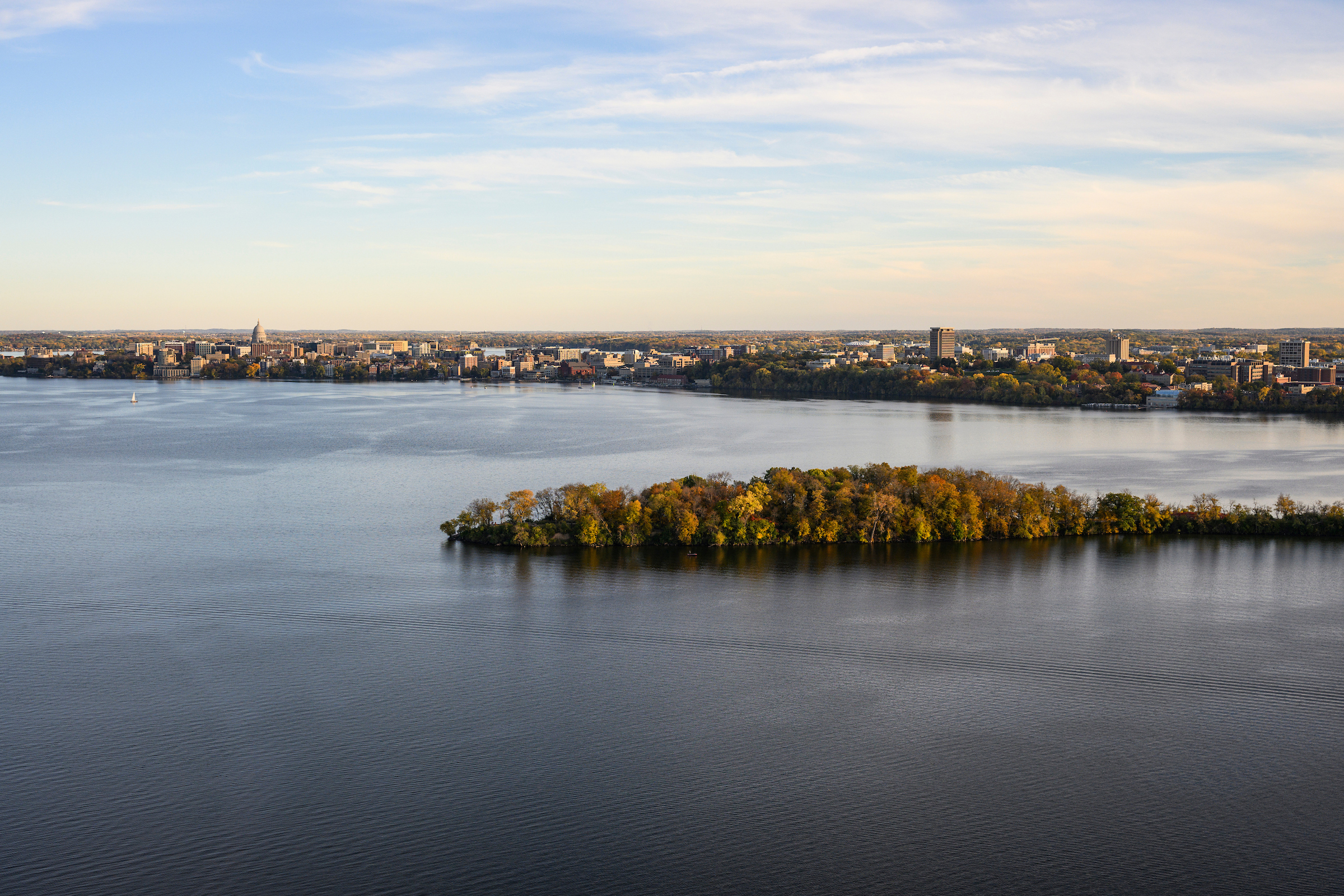 View of the UW-Madison campus and downtown Madison area, with Picnic Point in the foreground.